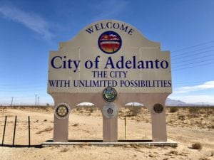City of Adelanto water tank with clear blue skies in the background
